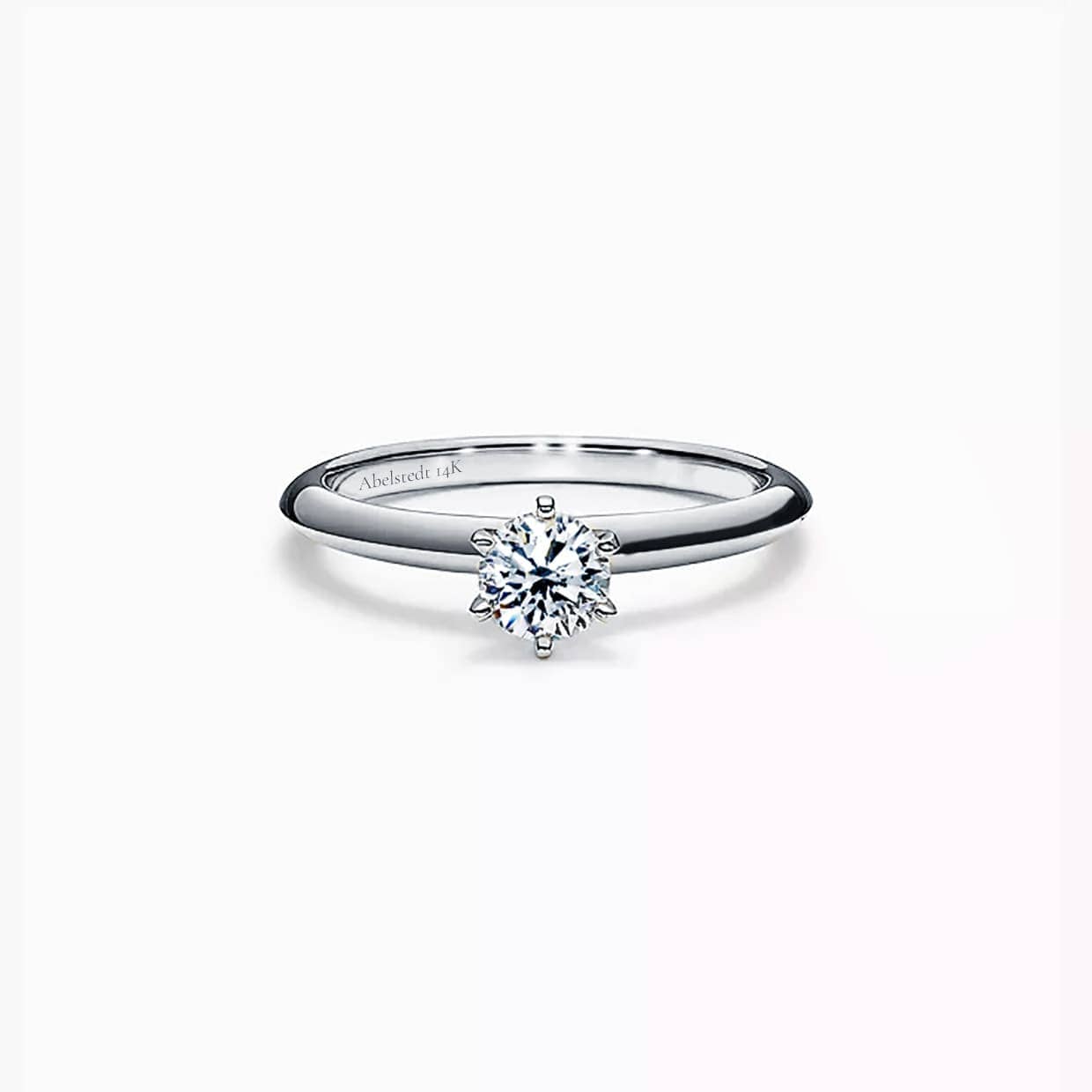 Mia Forlovelsesring med hvid round cut safir i hvidguld